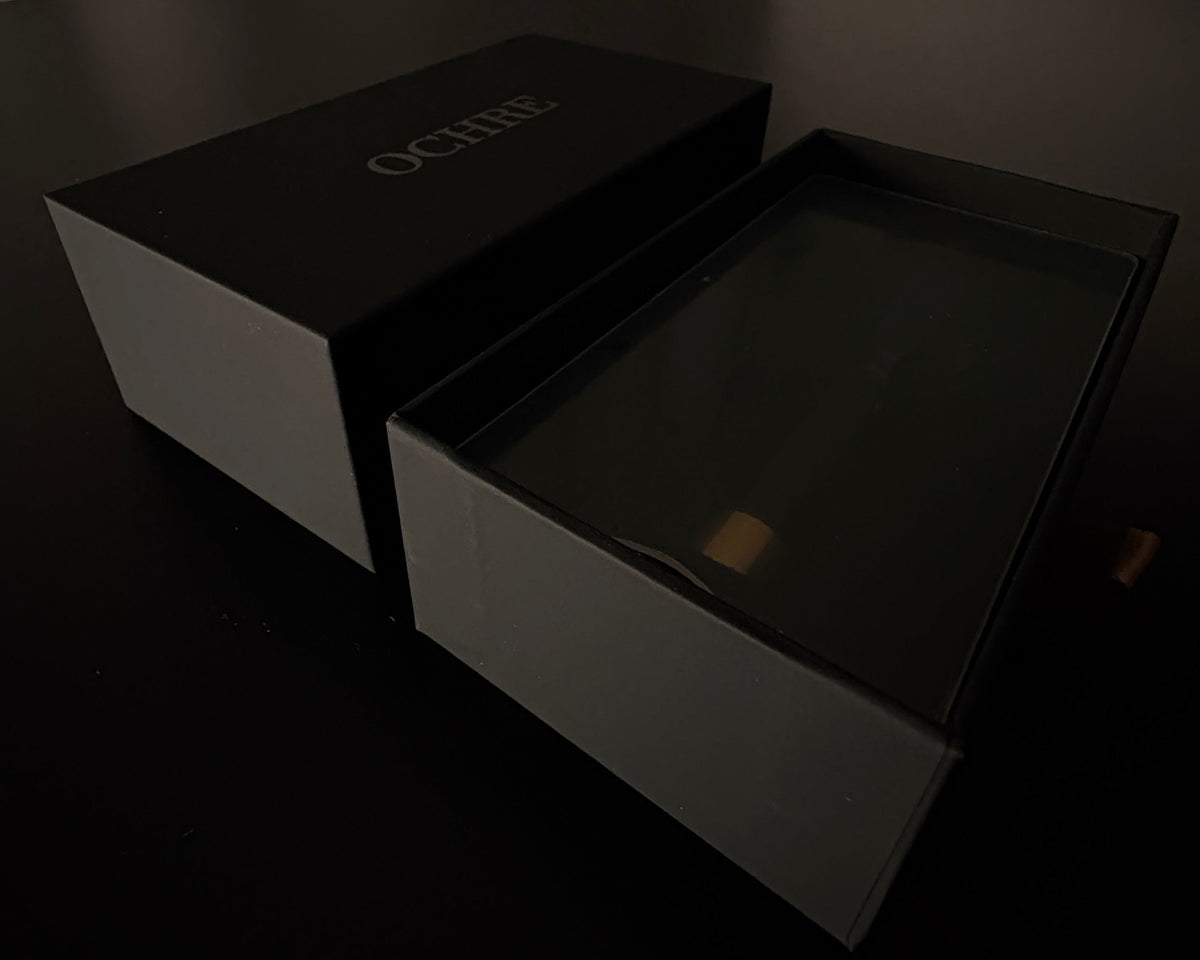 Open drawer box with the brush seated in foam
