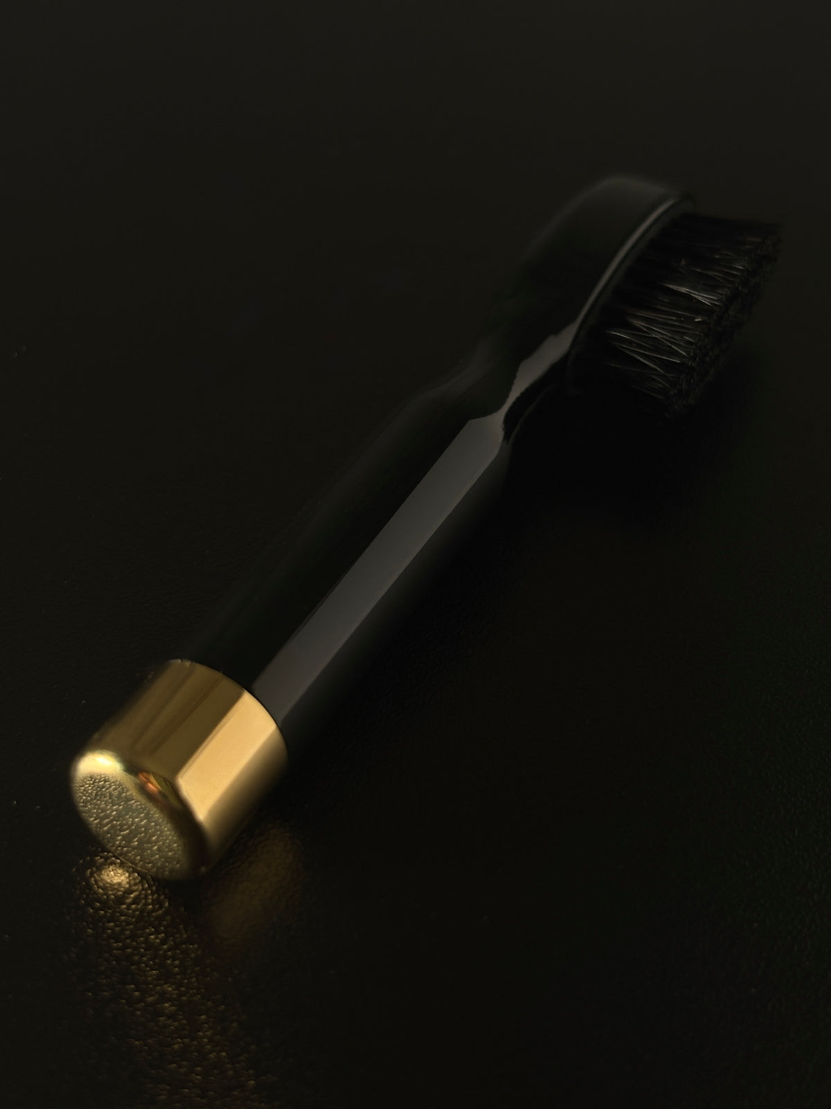 The Ochre mustache brush on black leather