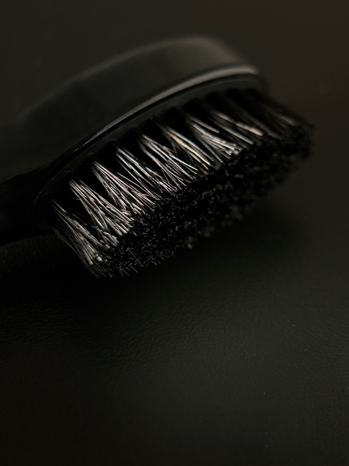 Close-up of five rows of first-cut boar bristle on the Ochre mustache brush